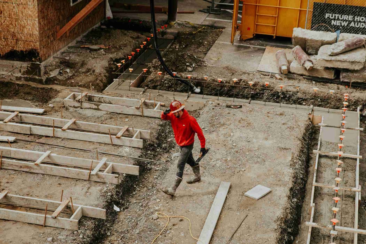 Roofing professional working on a building structure
